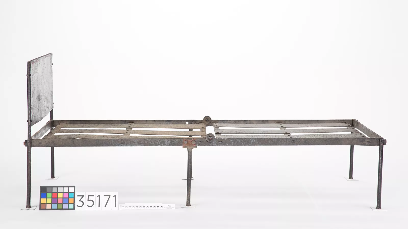 Historic folding camp bed from a museum collection