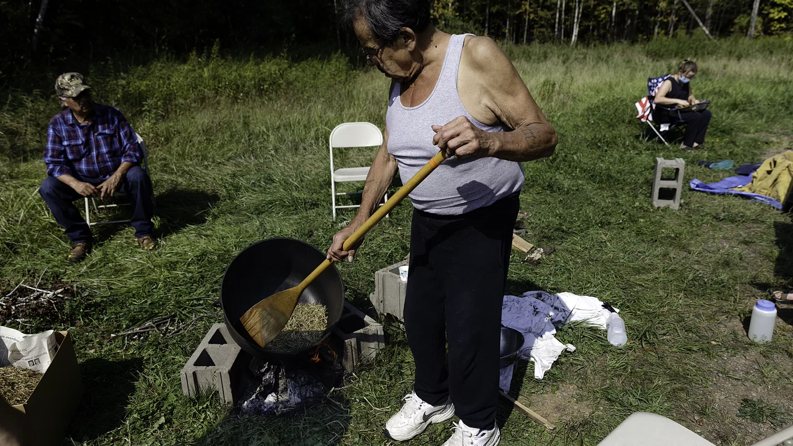 Cast-iron cooking vessel used over an open outdoor fire