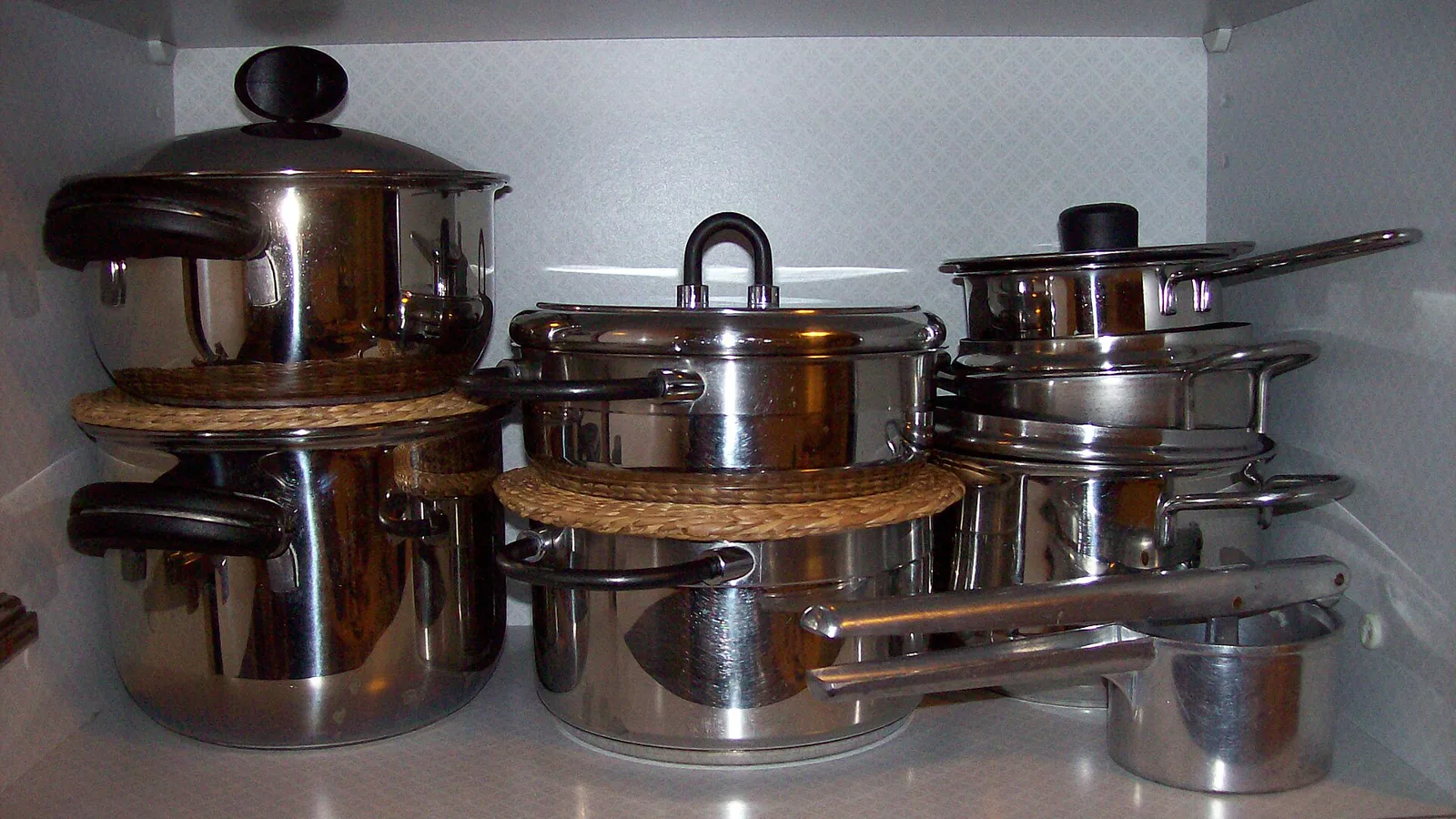 Stainless-steel cooking pots illustrating lighter camp cookware options