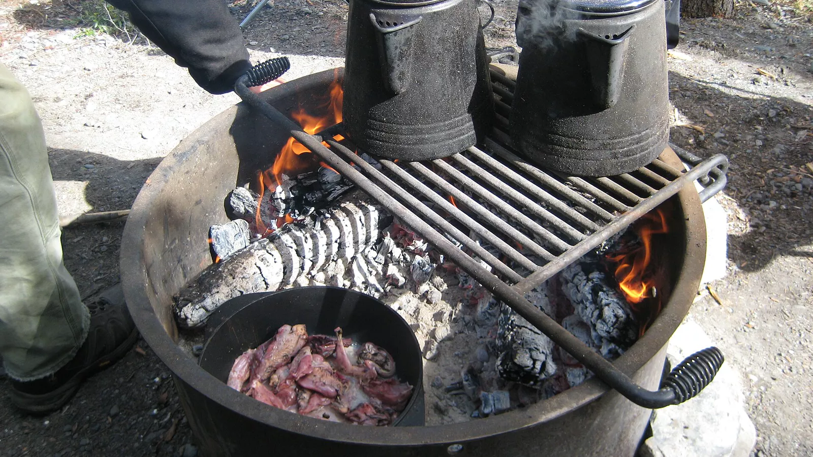 Food cooking over a permitted campfire