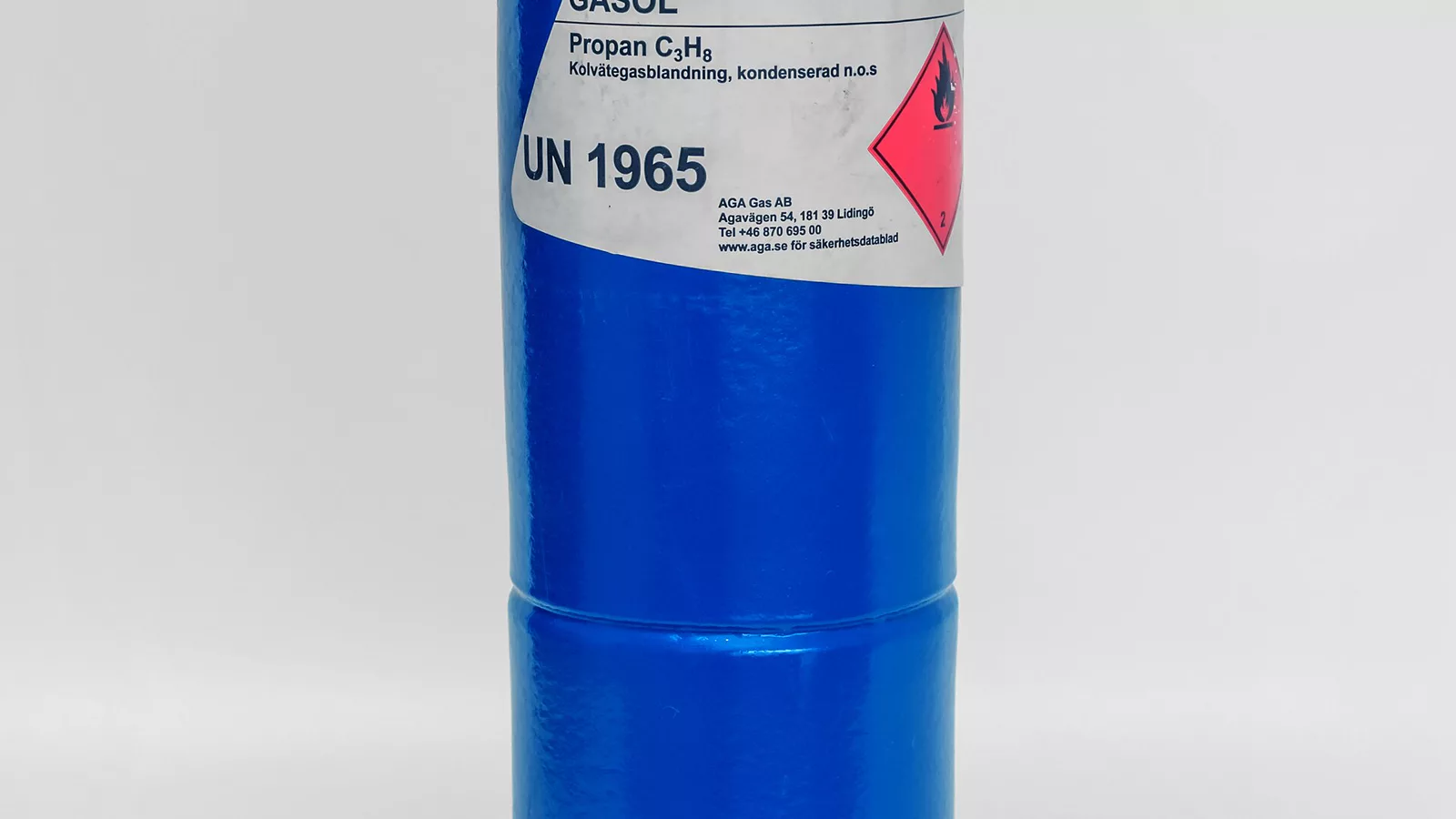 Propane camping cylinder used to supply an outdoor cooking appliance