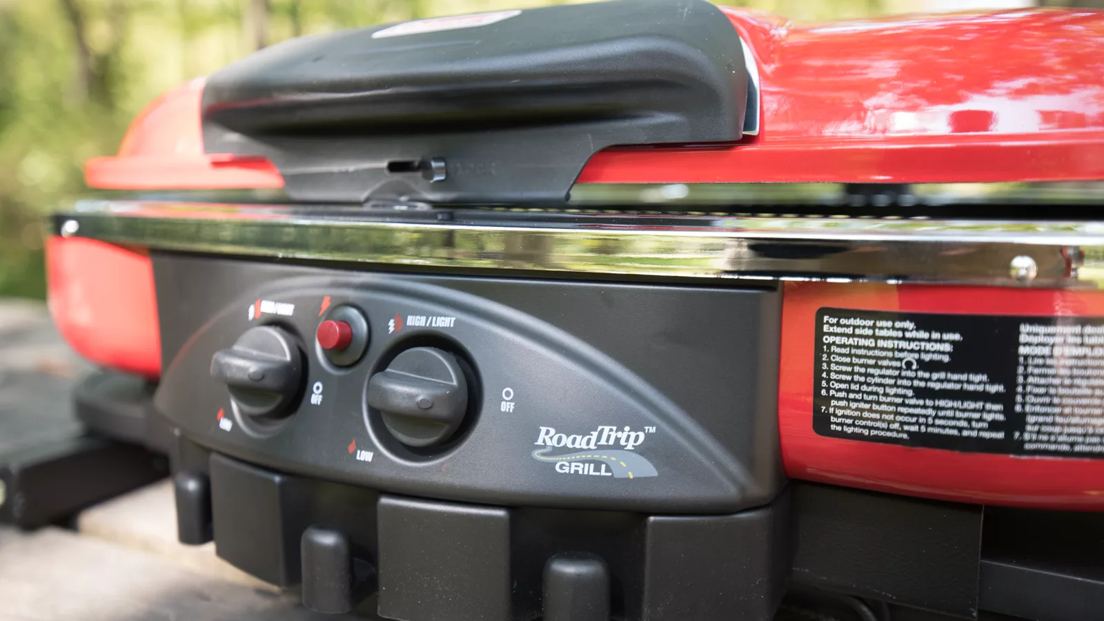 Portable propane grill set up for outdoor campsite cooking