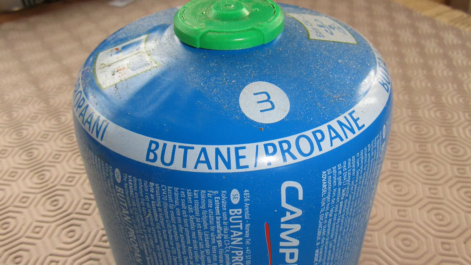 Larger disposable camping-gas cylinder illustrating container size differences