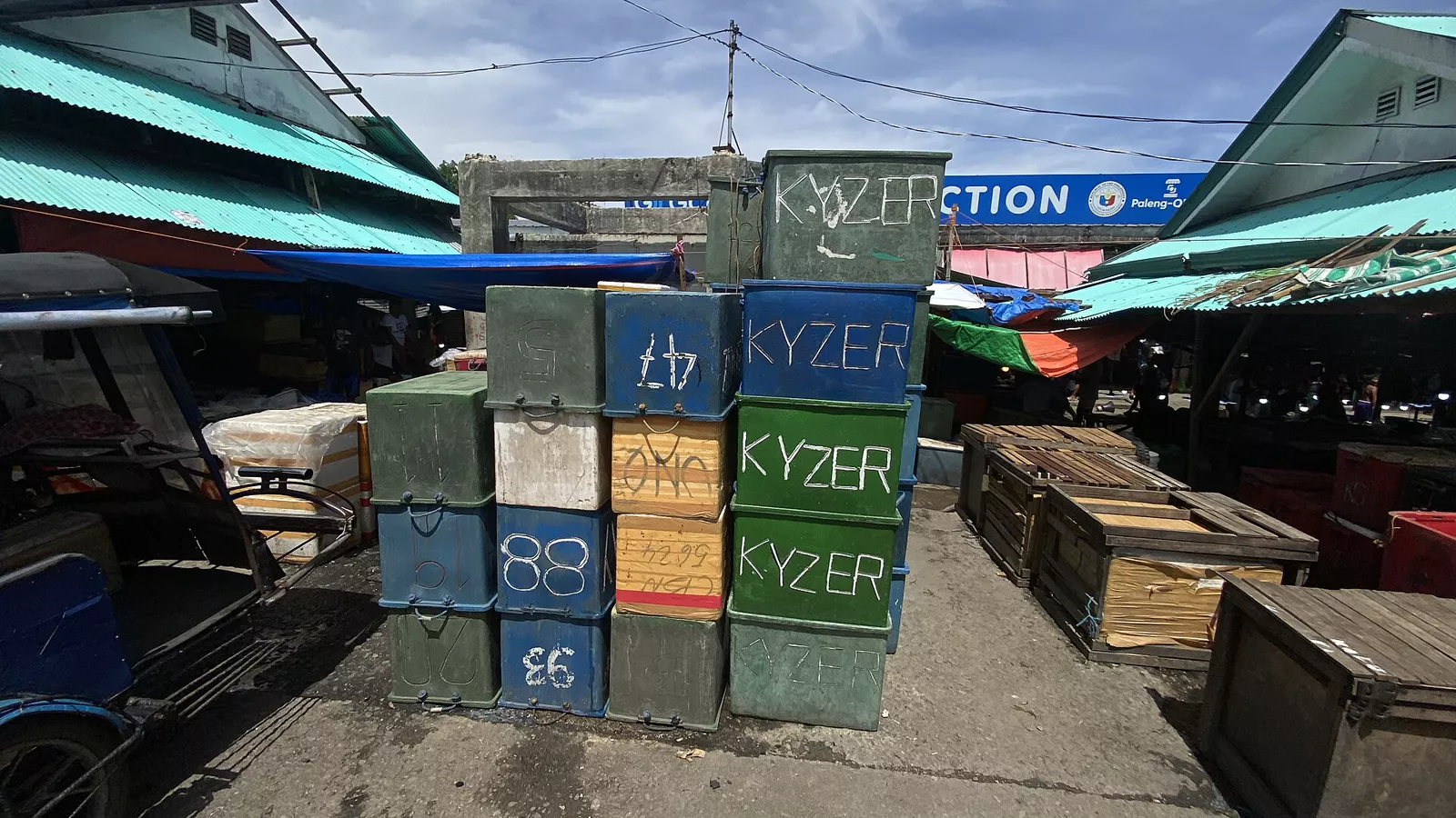 Stacked insulated cooler boxes awaiting cleaning and storage
