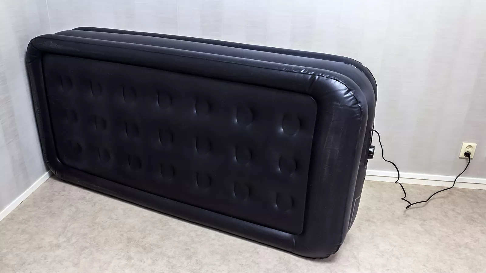 Large inflatable air mattress used as a bed